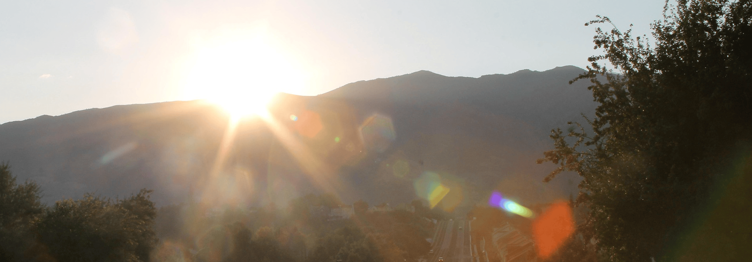 Sun over a mountain